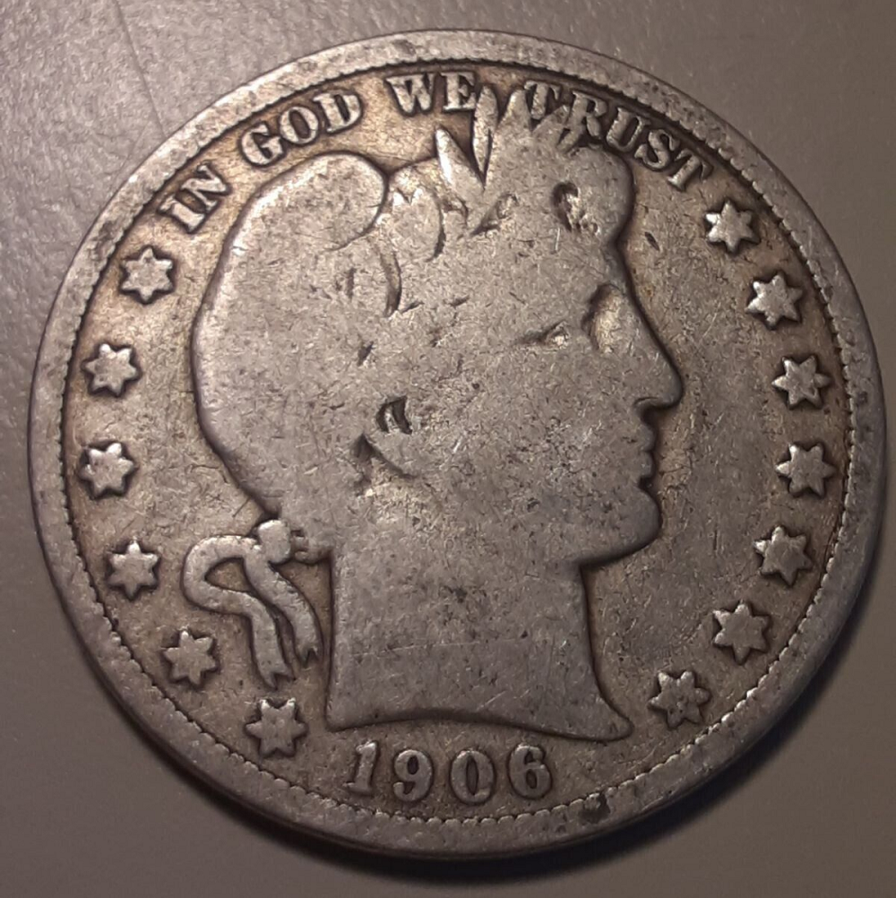 1906-D Barber Half Dollar misplaced date variety showing extra digit tops in denticles below the date
